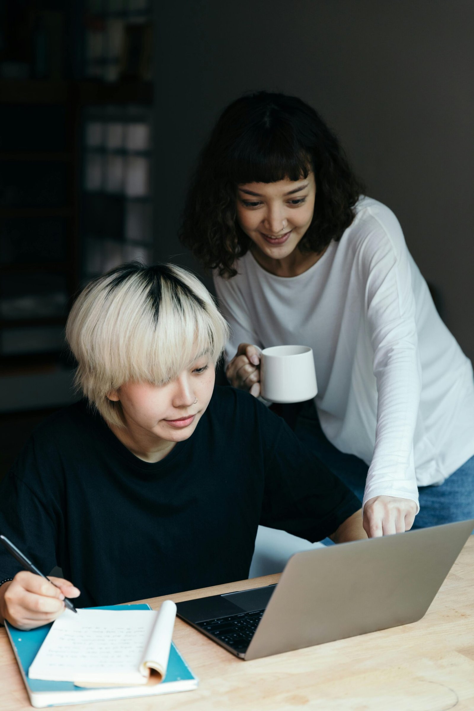 pexels-photo-4126759-4126759 Two young women working together at home using a laptop, sharing ideas and planning.